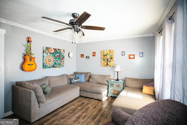 living room with dark wood-type flooring, ceiling fan, and ornamental molding