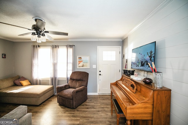 living room featuring ceiling fan, hardwood / wood-style floors, crown molding, and plenty of natural light