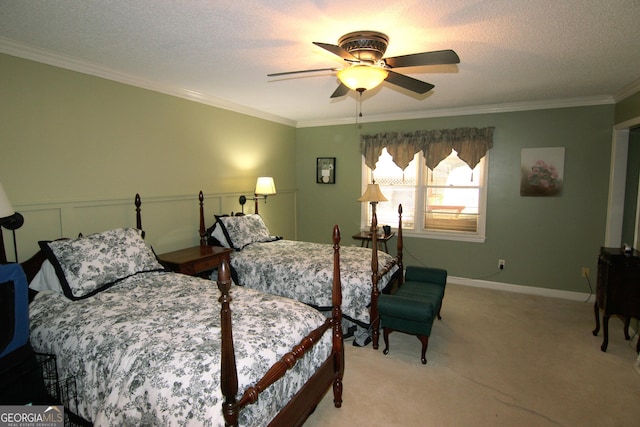 bedroom with a textured ceiling, ceiling fan, ornamental molding, and light carpet