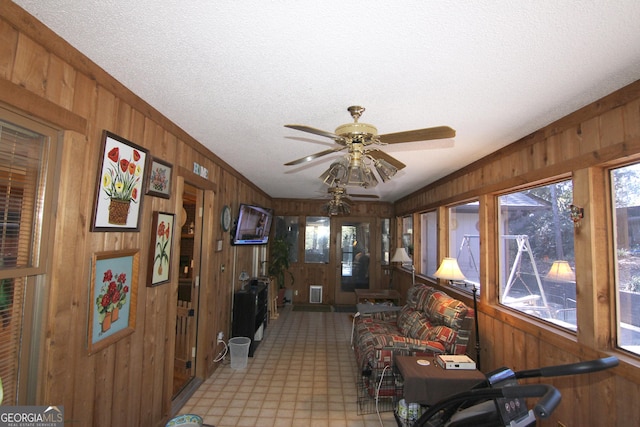 interior space featuring ceiling fan