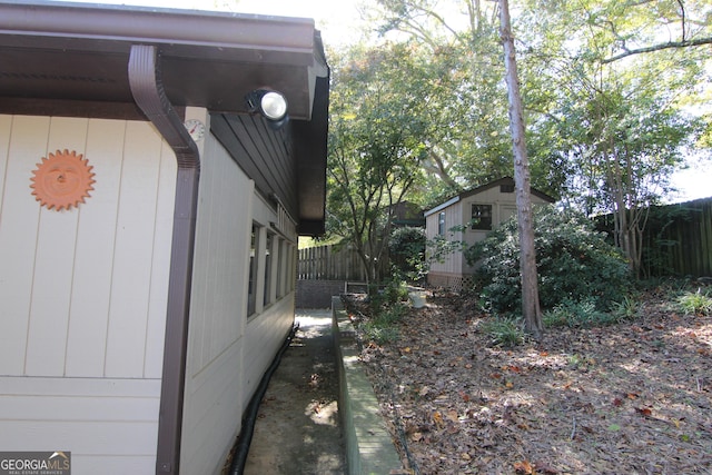 view of property exterior with an outdoor structure