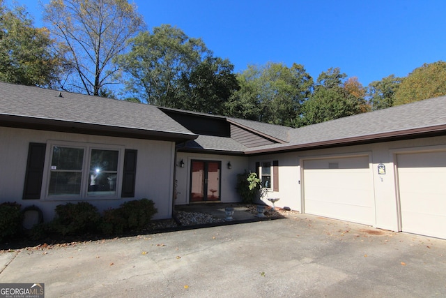 single story home with a garage