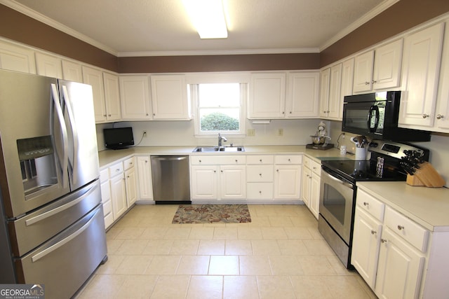 kitchen featuring white cabinets, appliances with stainless steel finishes, crown molding, and sink