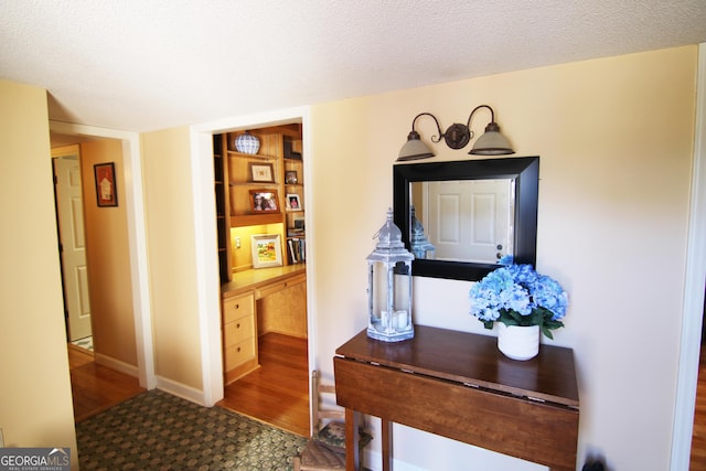 entryway with a textured ceiling