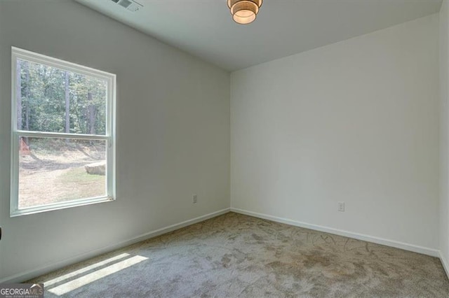 empty room featuring light colored carpet