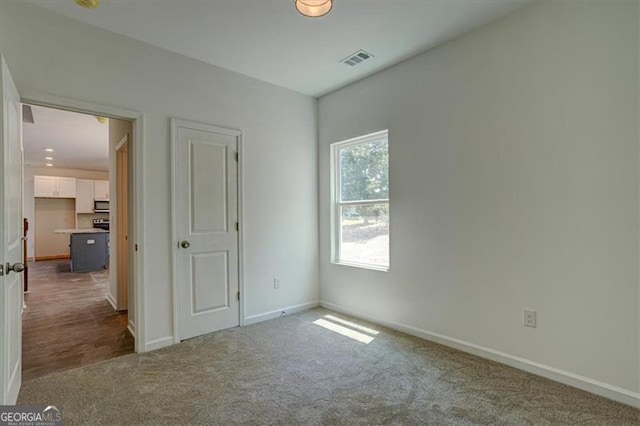 unfurnished bedroom with carpet