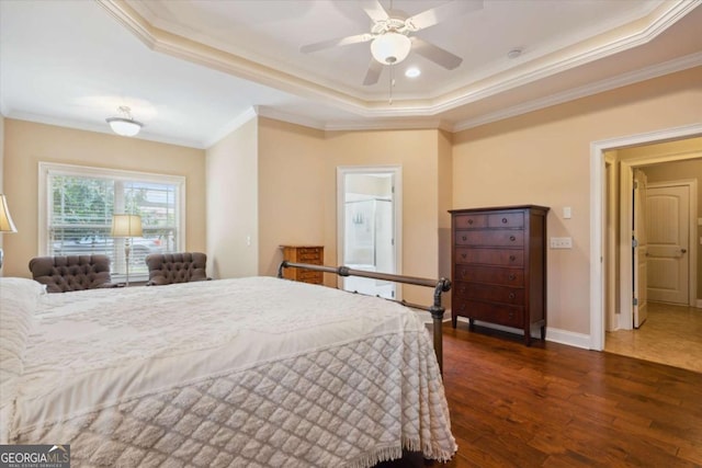 bedroom with ornamental molding, a raised ceiling, ceiling fan, and dark wood-type flooring