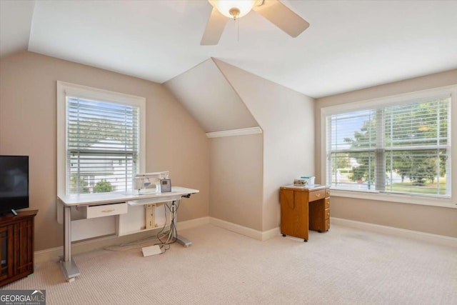 carpeted office featuring plenty of natural light, ceiling fan, and lofted ceiling