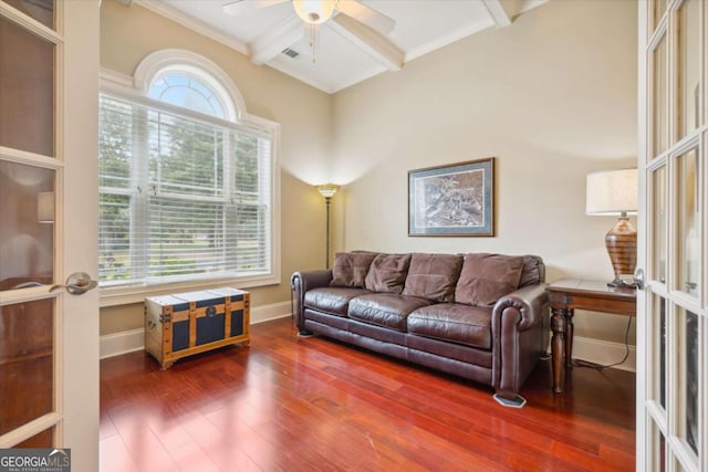 living room featuring french doors, ceiling fan, dark hardwood / wood-style floors, ornamental molding, and beam ceiling