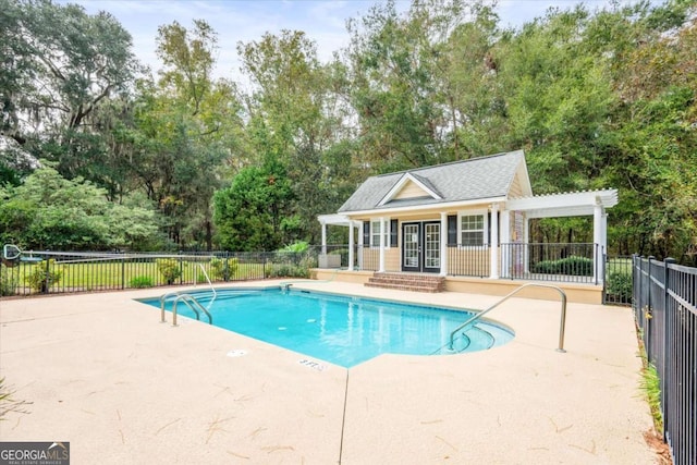 view of pool with a patio area and an outdoor structure