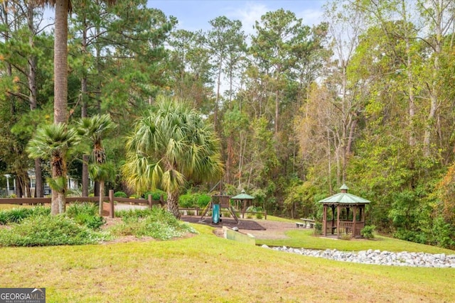 view of yard featuring a gazebo and a playground