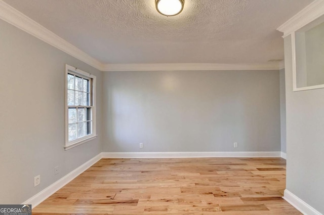 unfurnished room featuring a textured ceiling, crown molding, and light hardwood / wood-style flooring