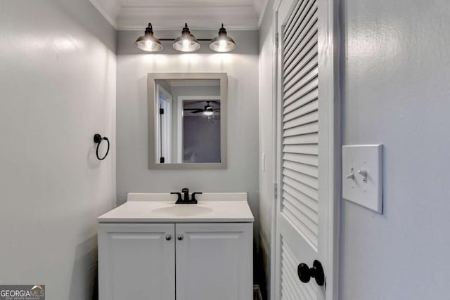 bathroom featuring vanity, ceiling fan, and ornamental molding