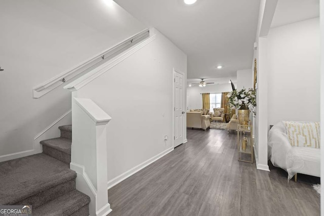 interior space with hardwood / wood-style floors and ceiling fan