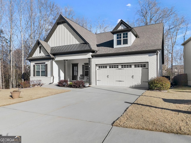 view of front of property featuring a porch and a garage