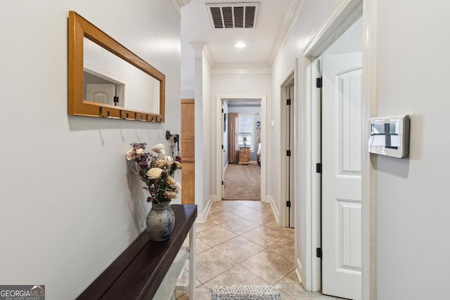 hall featuring light carpet and ornamental molding