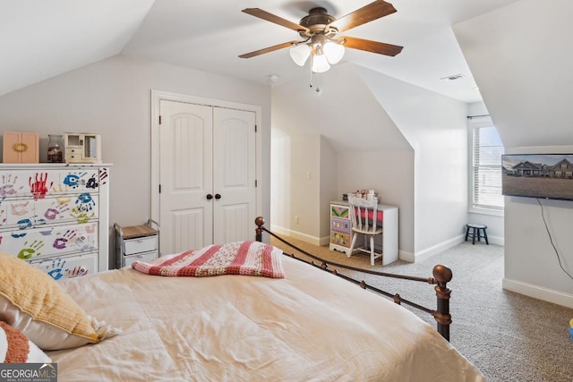 bedroom featuring ceiling fan, carpet flooring, a closet, and vaulted ceiling