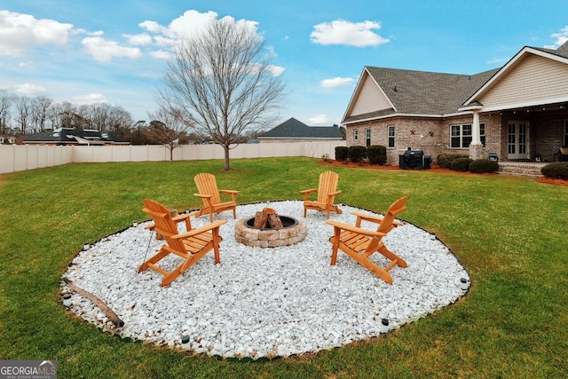 view of yard featuring a fire pit