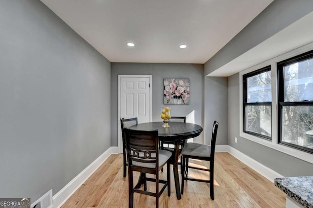 dining area with light wood-type flooring