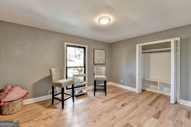 sitting room featuring light wood-type flooring