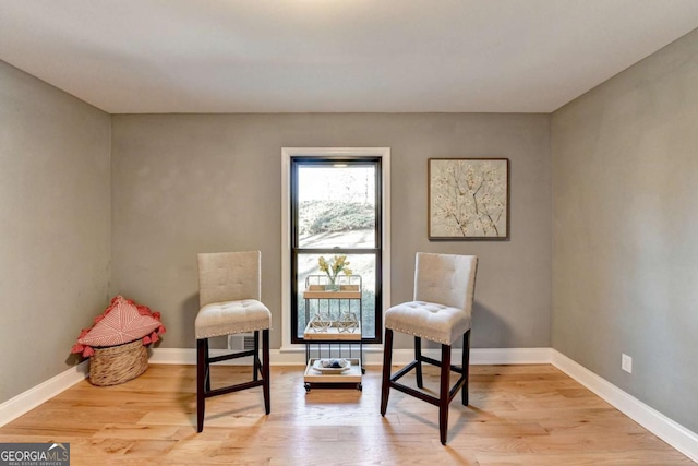 sitting room with light hardwood / wood-style floors