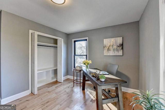 office with light hardwood / wood-style flooring