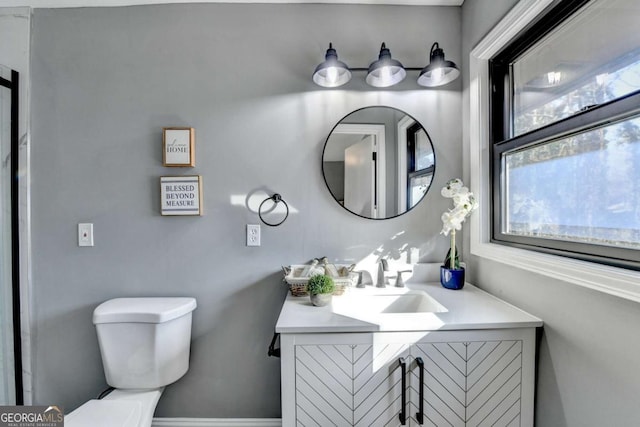 bathroom with vanity and toilet