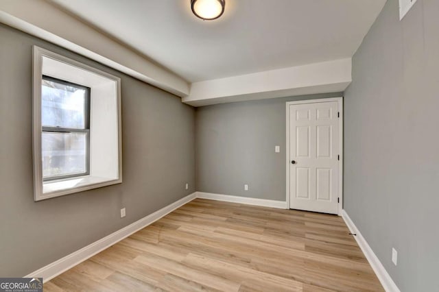 unfurnished room with light hardwood / wood-style floors