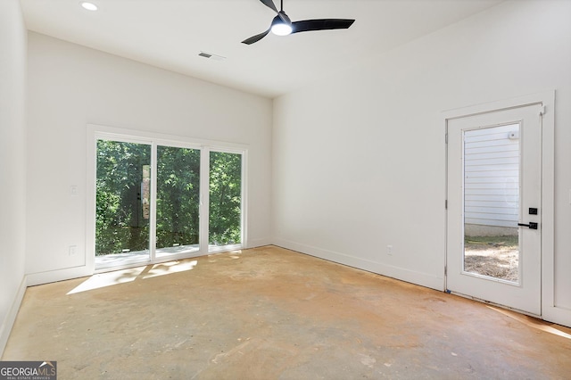 spare room featuring concrete flooring and ceiling fan