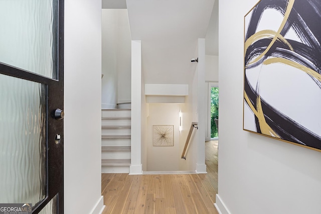 foyer entrance with light hardwood / wood-style flooring