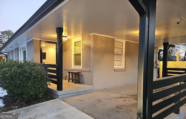 doorway to property featuring a patio area