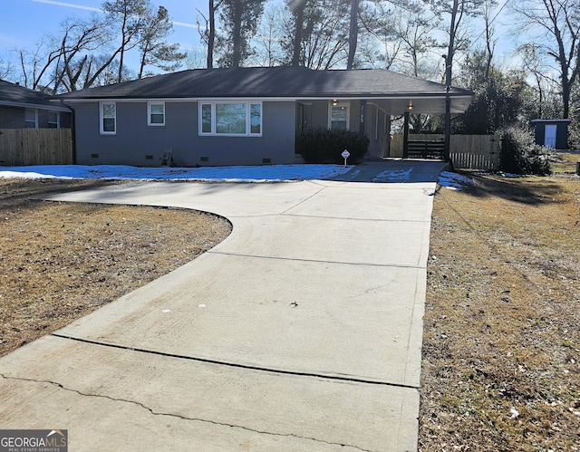 ranch-style house with a carport