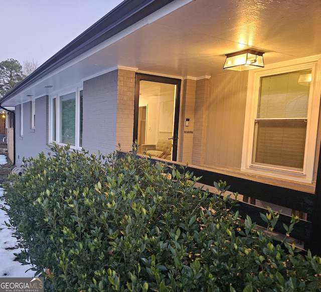 view of exterior entry at dusk