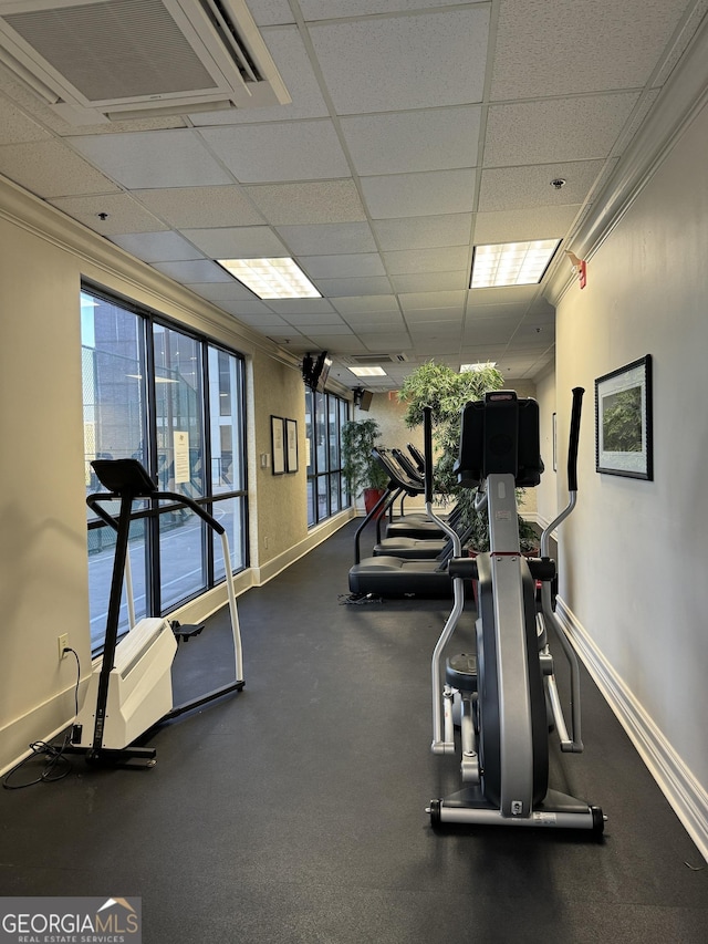 exercise room featuring a drop ceiling