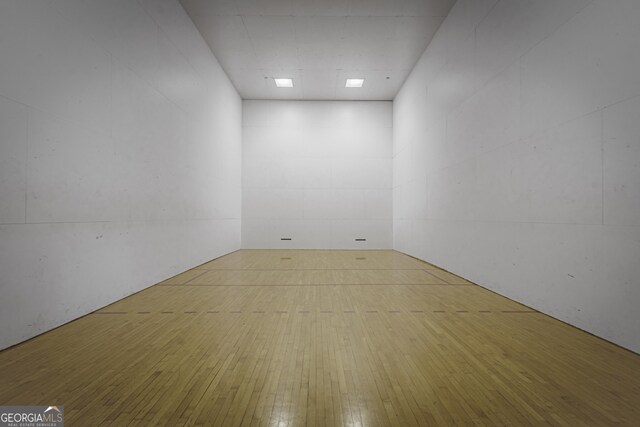 corridor with light wood-type flooring