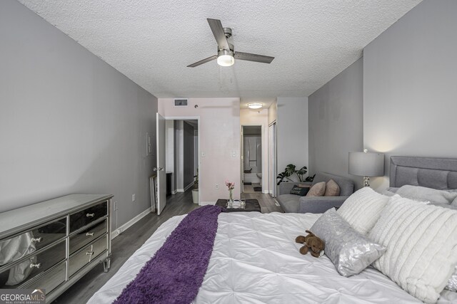 bedroom featuring access to outside, ceiling fan, light hardwood / wood-style flooring, and a textured ceiling