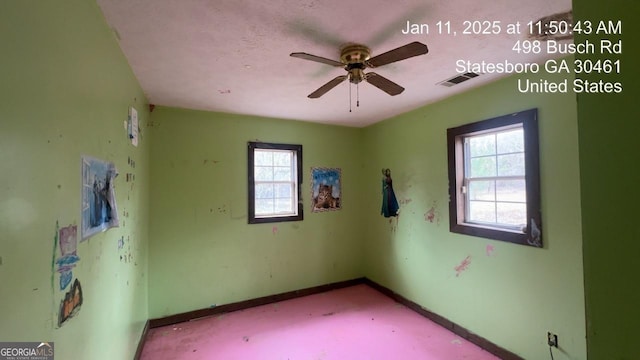 empty room featuring ceiling fan