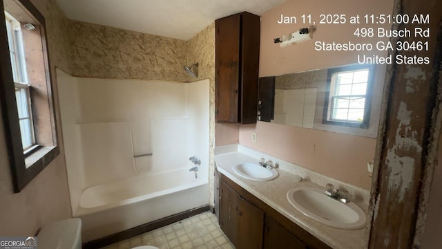 full bathroom featuring shower / washtub combination, vanity, and toilet