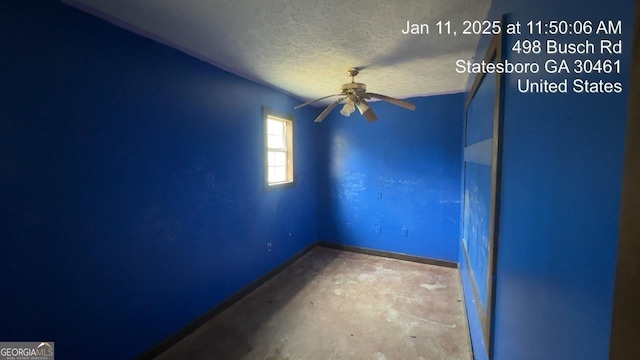 unfurnished room featuring ceiling fan, concrete floors, and a textured ceiling