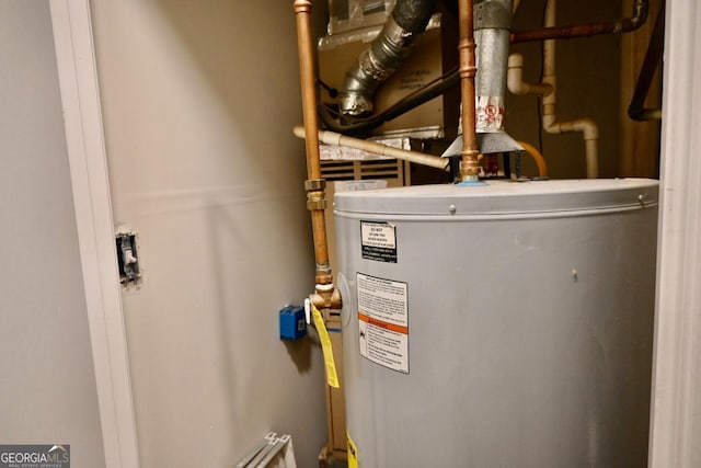 utility room with gas water heater