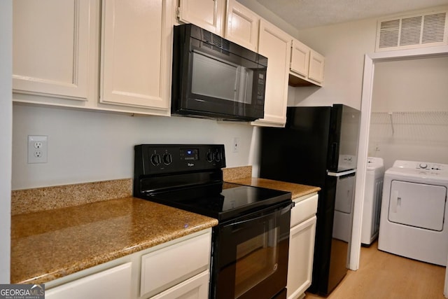 kitchen with white cabinetry, light hardwood / wood-style flooring, a textured ceiling, washer and clothes dryer, and black appliances