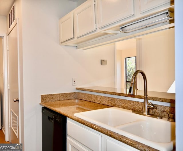 kitchen with white cabinetry, dishwasher, and sink