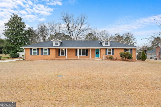 single story home with a porch