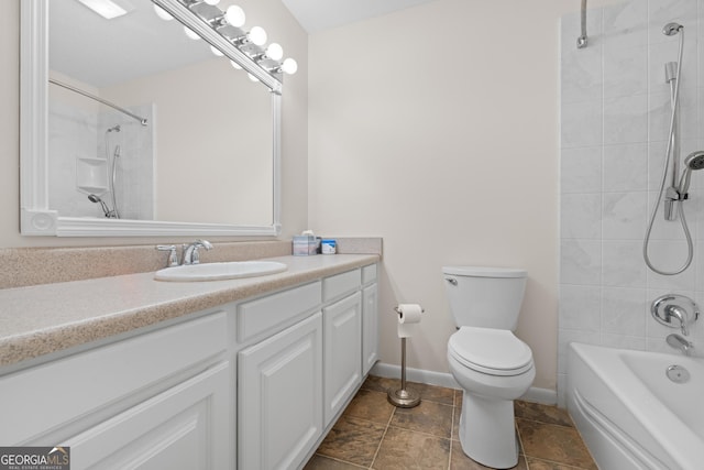 full bathroom featuring vanity, tiled shower / bath combo, and toilet