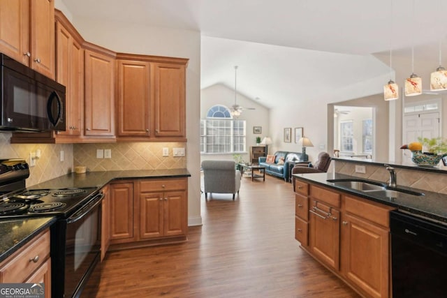 kitchen with sink, vaulted ceiling, ceiling fan, and black appliances