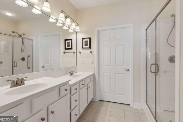 bathroom featuring vanity, tile patterned floors, and walk in shower