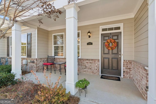 property entrance featuring a porch