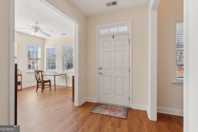 entrance foyer featuring ceiling fan and light hardwood / wood-style flooring