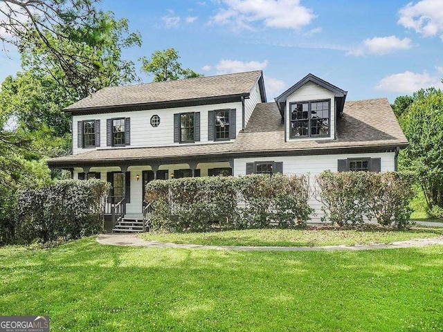 view of front of property with a porch and a front yard