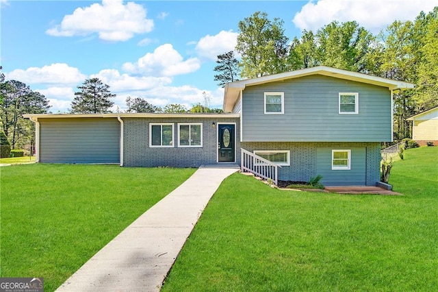 split level home with a front yard